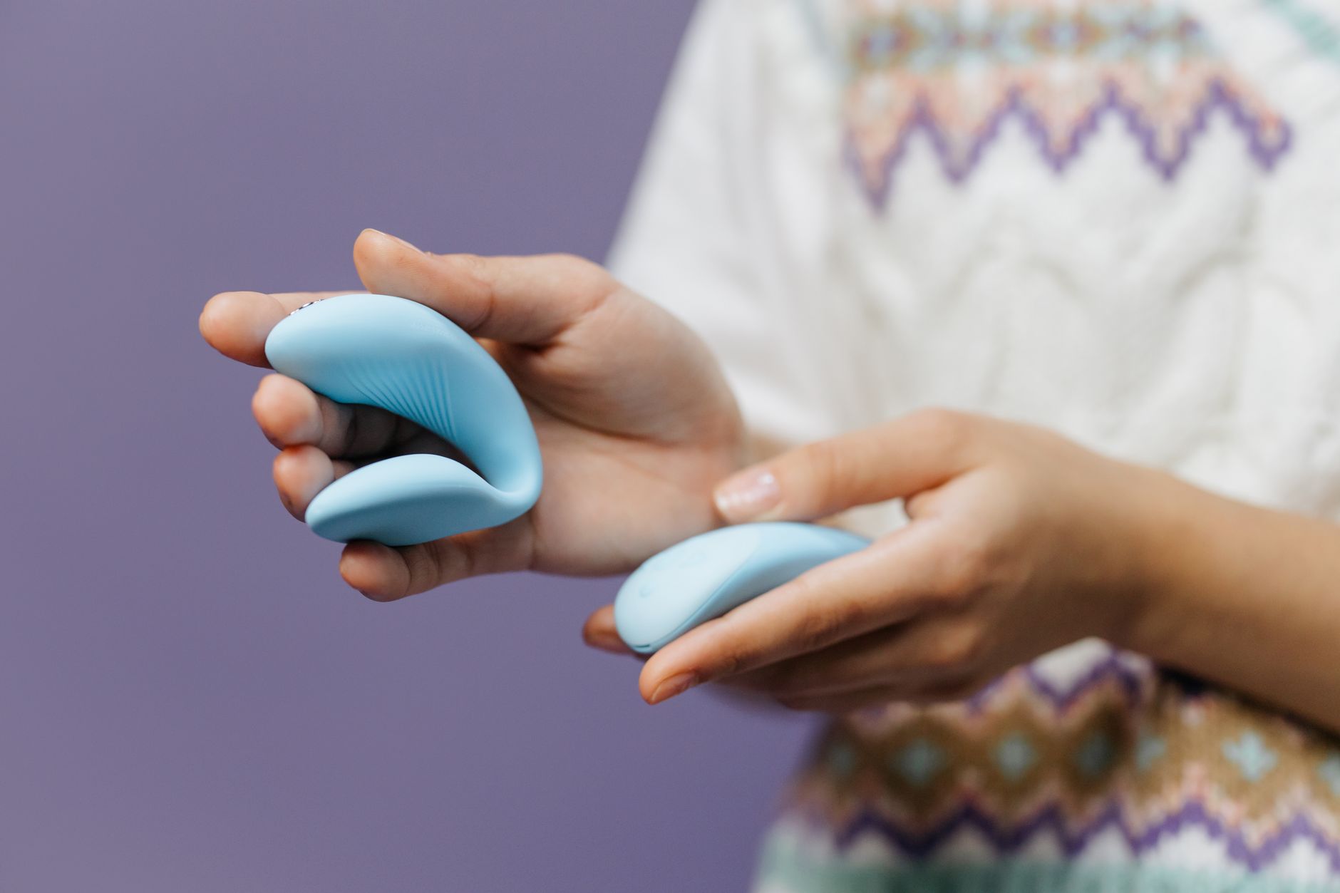 Hands holding a sleek lemon vibrator, symbolizing reconnection and self-care.