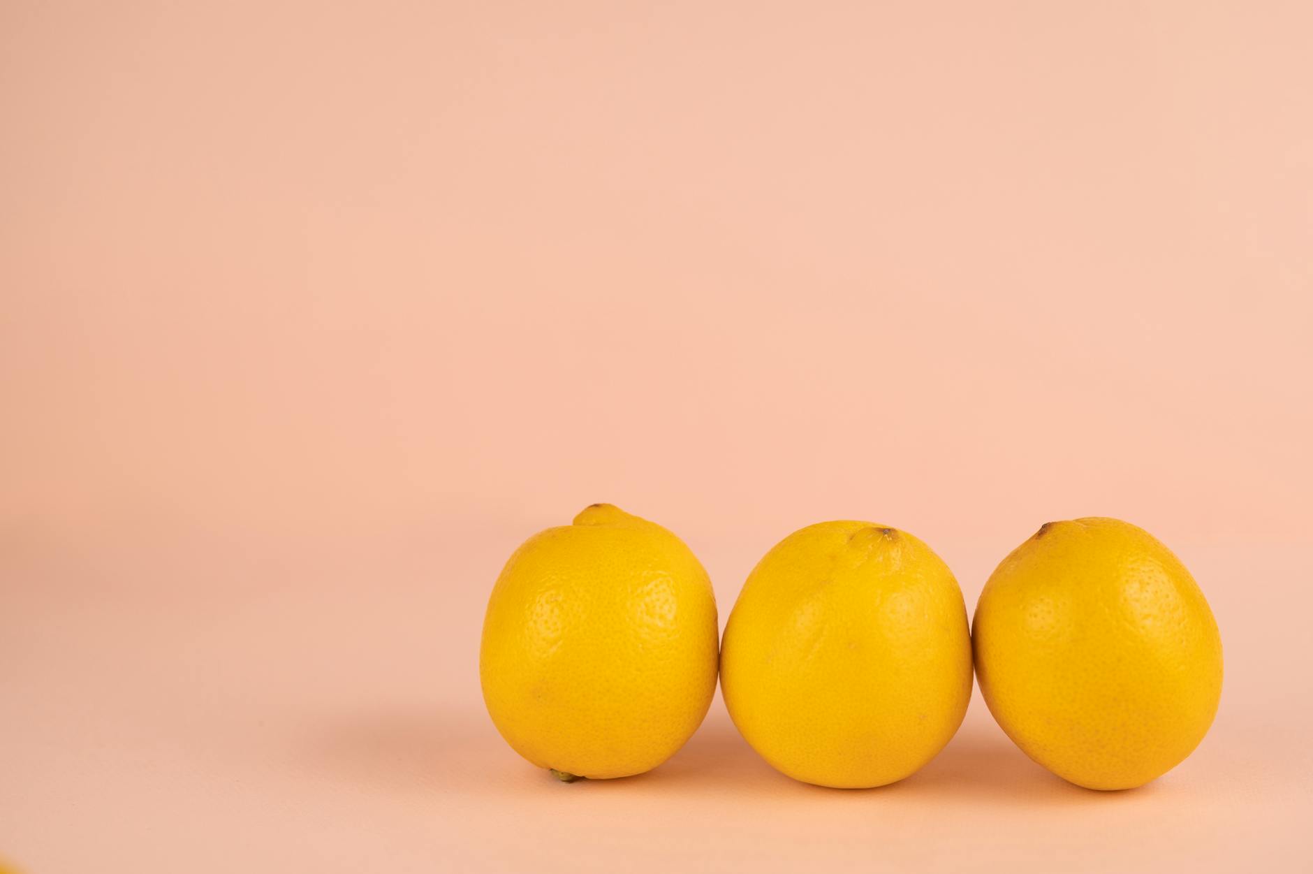 Colorful clitoral vibrators arranged on a bright yellow background, representing variety and pleasure exploration